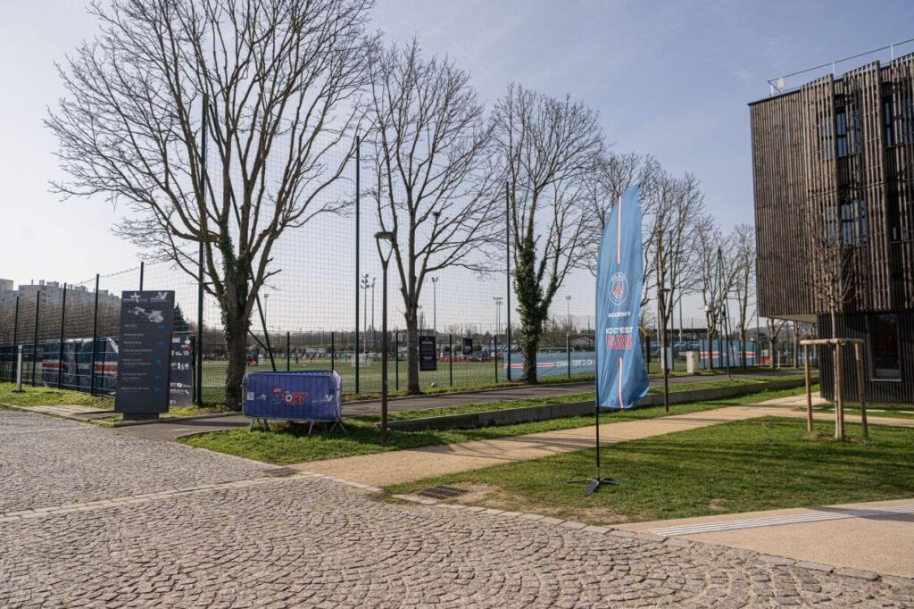 Sports facility with trees and signage